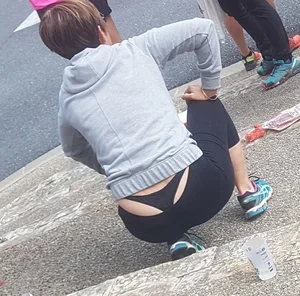 Short haired milf sitting showing her thong