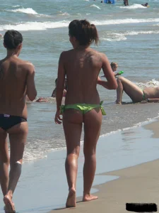 Bunch of sexy babes at the beach in thong bikinis