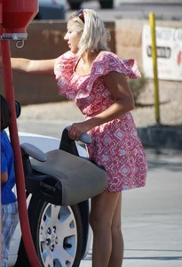 Sexy blonde upskirted in pink dress while cleaning her car