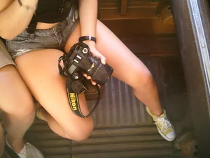 Sexy girl on the bus in jean shorts with nice legs and cleavage