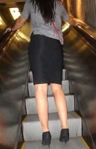 Girl in a Skirt, Pantyhose And High Heels on an Escalator Creepshot