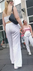 Long blonde braless in a white outfit (many pictures)