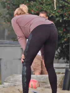 Beach volleyball blonde lady in tight leggings