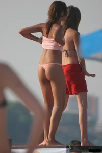 A bunch of sexy beach voyeur babes in bikinis, thongs and topless