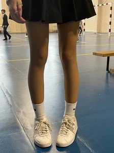 Skinny college teen's legs closeup