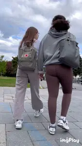 Tall curlyhead college girl in skin coloured leggings