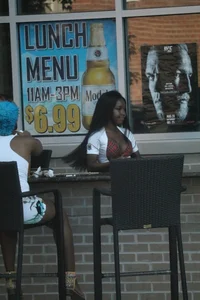 Sexy ebony Tilted Kilt employee in her uniform