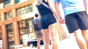 Perfect ass in spandex shorts and hot thighs closeups at the crosswalk on the street creepshots