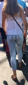 Girl in wet jeans making them semi see through