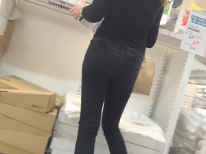 Skinny girl shopping in tight black jeans