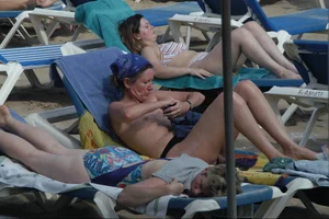 Girls on a nude beach in Sitges, Spain