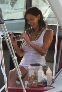 Bikini babe on a boat with a wet see through white shirt showing her tits