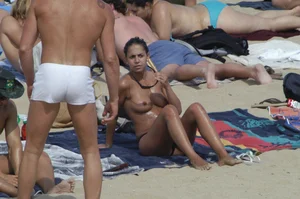 Topless girls on a beach in Barcelona