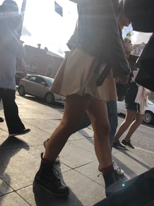 Nice legs, candid girl wearing a skirt and boots