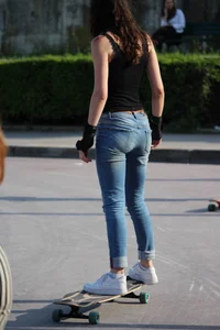 Skinny Girl in Tight Jeans on a Skateboard Candid Photos Gallery