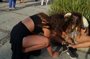 2 girls in short shorts showing legs and a little more part 2