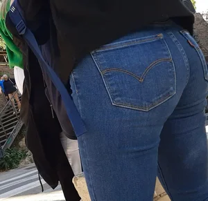 Two beautiful teens in jeans. One white and one blue jeans