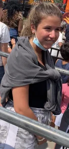 Teen with braces waiting in line for a ride
