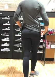 Shoe store employee with a sexy bubble butt in leggings