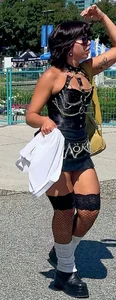 Cheeks hangin’ out of little black skirt