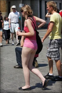 Girl showing serious ass cheeks and great ass in tiny pink shorts