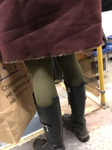 Cute candid winter girl in a public bus, closeups of her slim legs in green pantyhose and boots