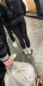 Tight ass sports team in line at airport