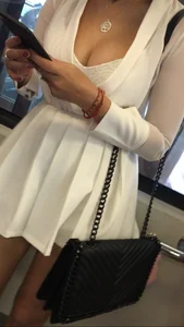 Beautiful candid Asian girl on the train showing some cleavage