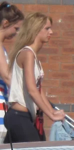 Sexy and slim blonde in see thru leggings with thong