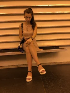 Girl Sitting Cross-Legged Public Candid Photo