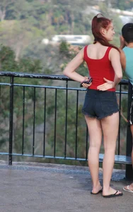 Redhead beauty in short shorts showing some cheeks and panties