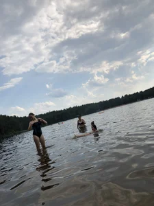 Girls in One-Piece Body Swimsuits Running Towards Water and Swimming - Beach Photo Gallery