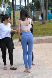 Hula hooping skinny Asian in light blue leggings with vpl