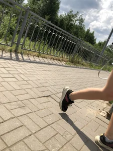 Cute Girl in Denim Shorts Walking Down a Railway Station Gallery
