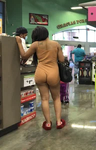 Latina with hard nipples and a big booty in tight spandex shorts outfit
