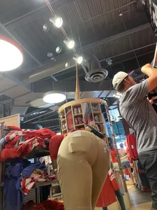 Bunch of girls in various outfits at a Cardinals baseball game