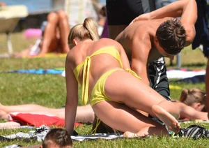 Blonde looking sexy in a yellow bikin