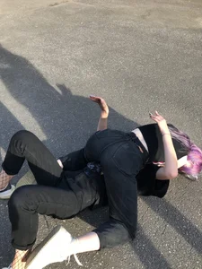 Girls in Tight Black Jeans Wrestling on the Ground