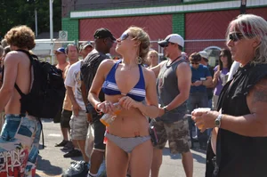 Hot ass Canadian babe in a bikini dancing at a concert