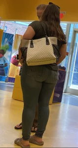 Thick brunette filling out jeans at Lego Store