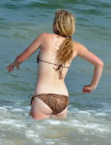 Cheetah print bikini blonde at the beach with nice body