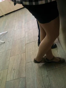 Nice Legs of a College Teen in Sandals, Shorts And Pantyhose Photo