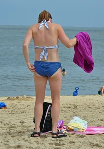 Blue bikini beach girl undressing with a decent ass