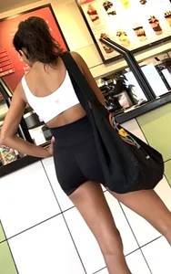 hot petite Indian chick showing some T&A in skimpy workout clothes