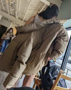 Slender asian teen oblivious at the cafe