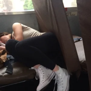 Girl in Sneakers And Leggings Asleep in a Public Bus Spy Photo