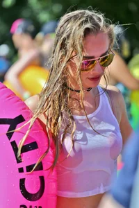 Tubing hottie in shorts and a wet white shirt