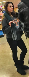 Fit shopping brunette girl in leggings and a hoodie with a nice ass