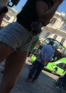 Shorts girl walking with nice legs and some cheeks showing