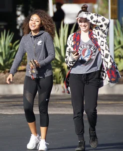 Beautiful black girl in Nike leggings in the parking lot